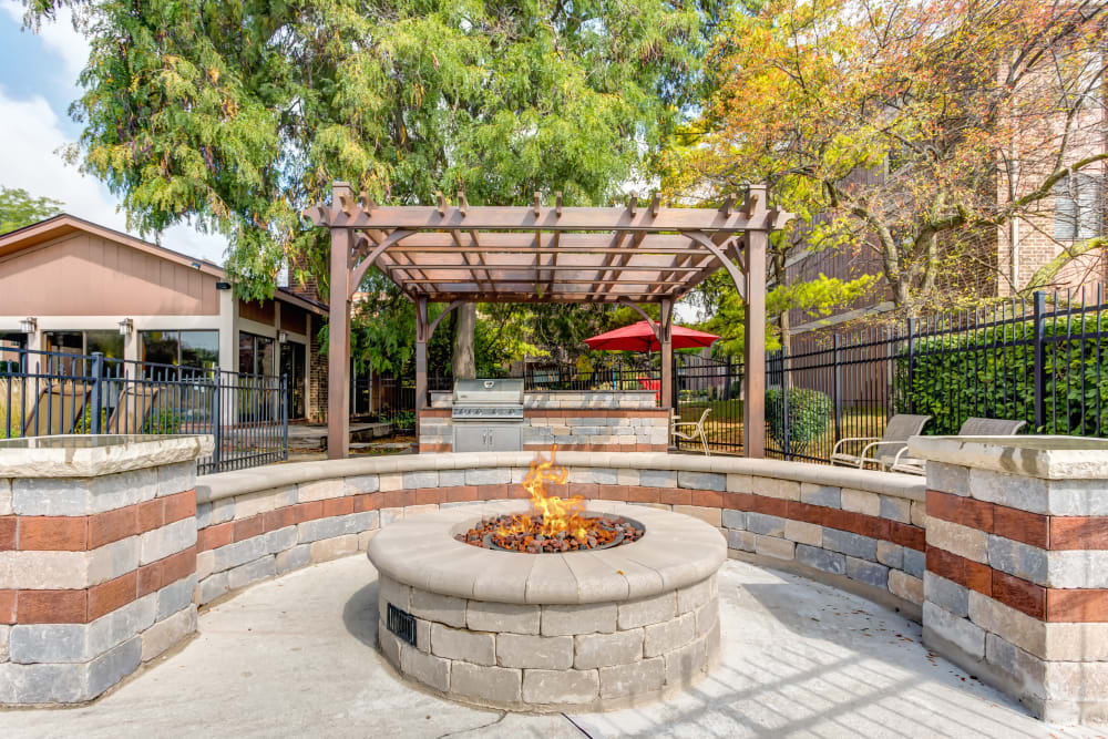 Resident lounge with wood-style flooring at Lakeside Apartments in Wheaton, Illinois