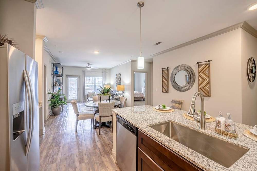 Open concept kitchen and living area at Caliber at Hyland Village in Westminster, Colorado