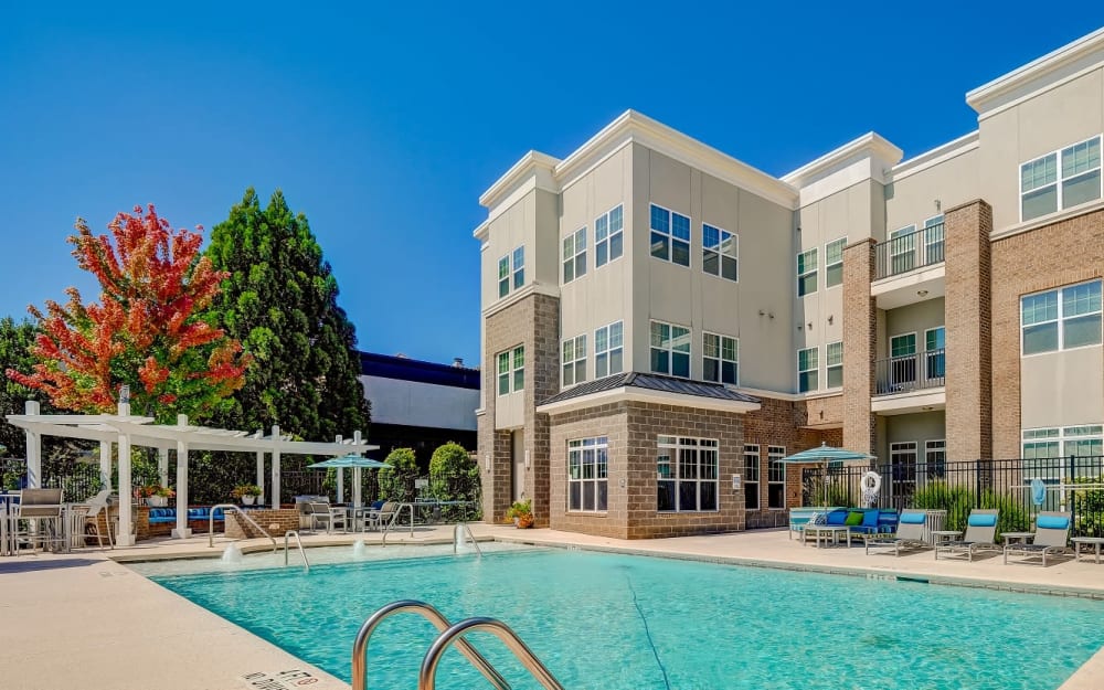 Resident mother and daughter playing in the swimming pool at Reserve at Kenton Place Apartment Homes in Cornelius, North Carolina