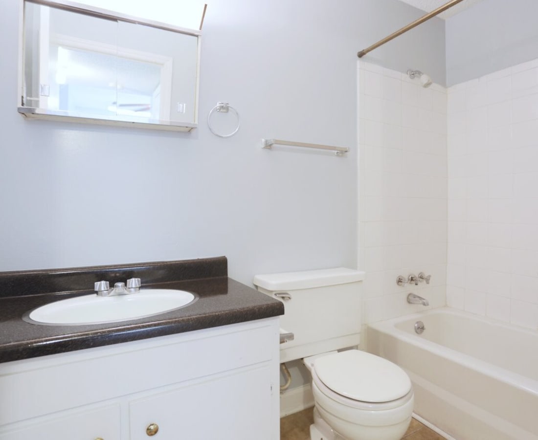 A bathroom with a tub and shower at Meadowbrook and Brookridge in Charlotte, North Carolina