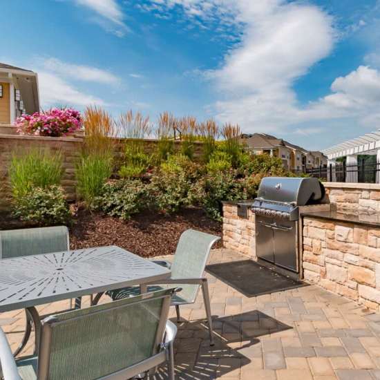 Patio Area with Grilling Station at The Apartments at Goose Creek in Fishersville, Virginia