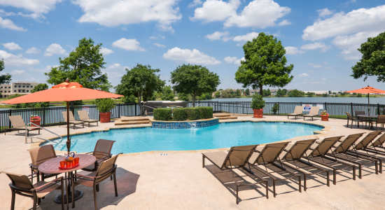 Pool and Patio at Crescent Cove at Lakepointe apartments in Lewisville, TX
