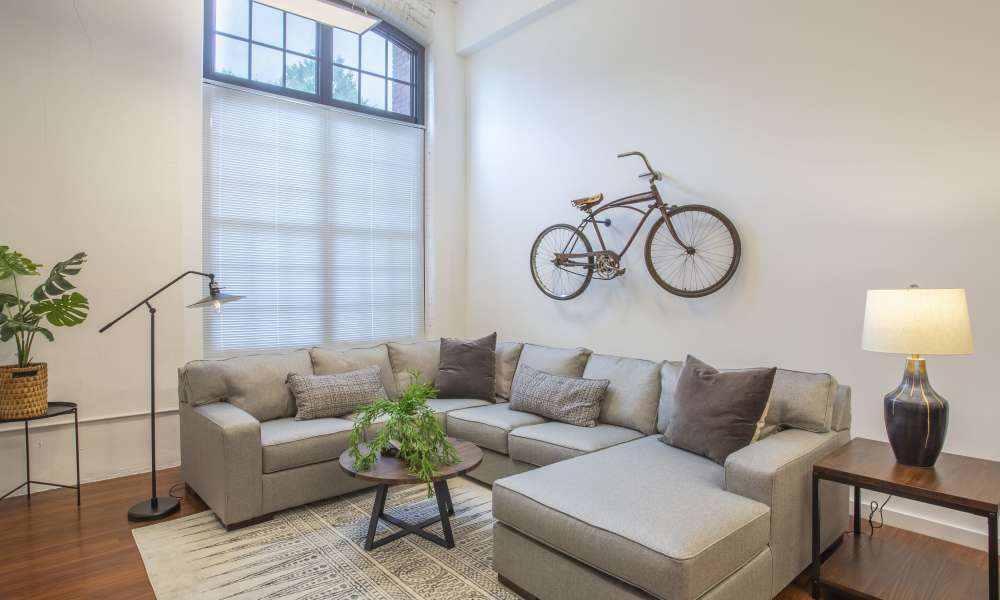 Well-furnished modern living area of an apartment at Lofts at Inman Mills in Inman, South Carolina