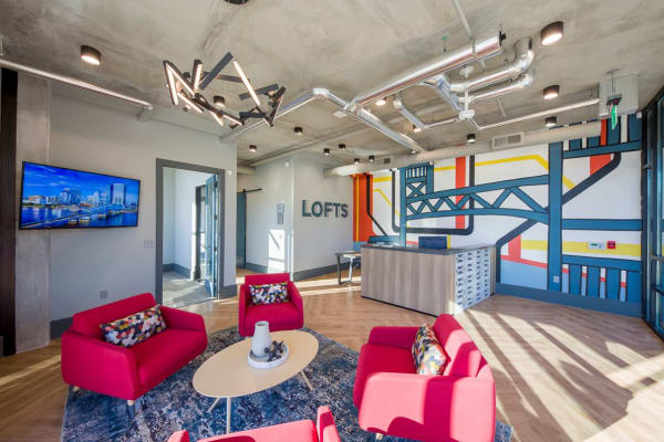 Reception space with hardwood floors and contemporary furniture at a property managed by WRH Realty Services, Inc 