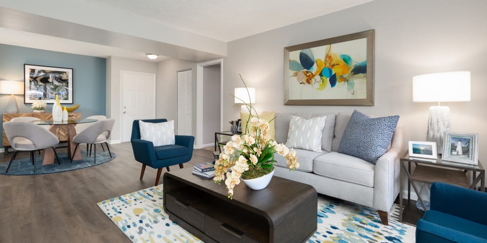 Spacious living room and kitchen area in a model home at Beach Walk at Sheridan in Dania Beach, Florida