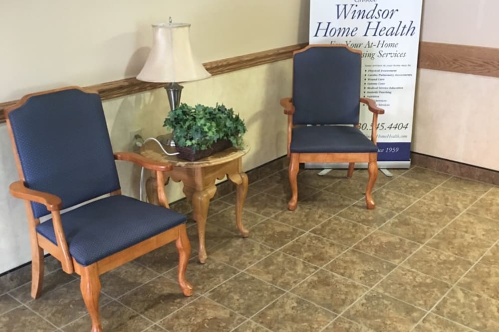 Blue chairs in hallway at Windsor House at Guardian in Youngstown, Ohio