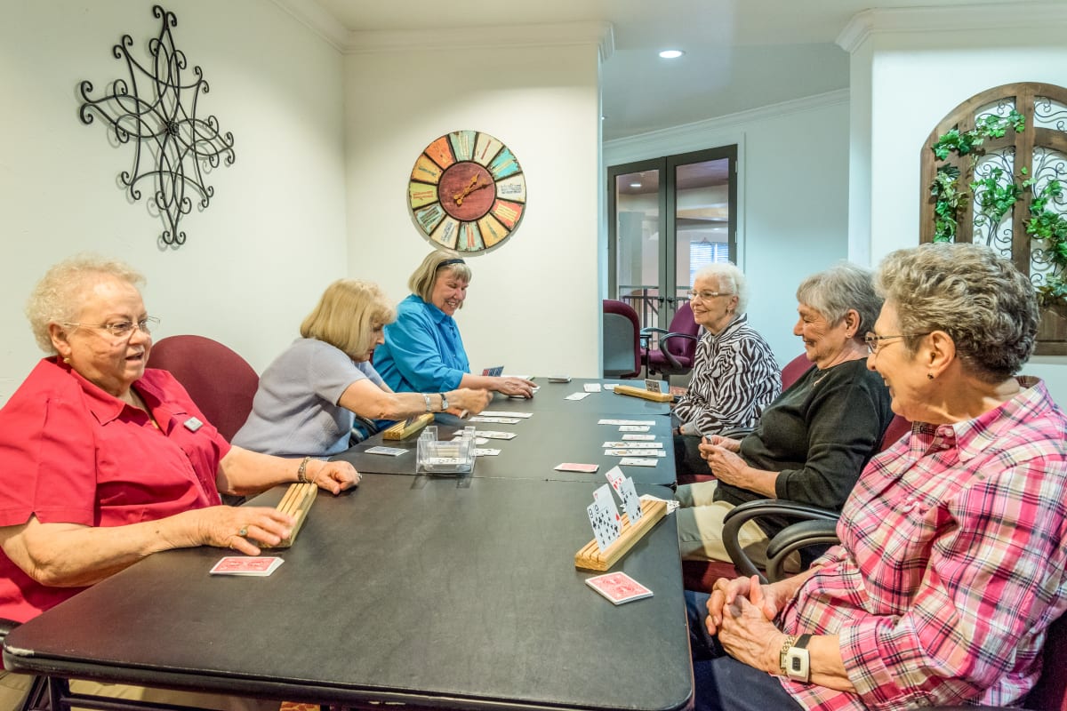 Residents enjoying a game of cards at Watermere McKinney in McKinney, Texas