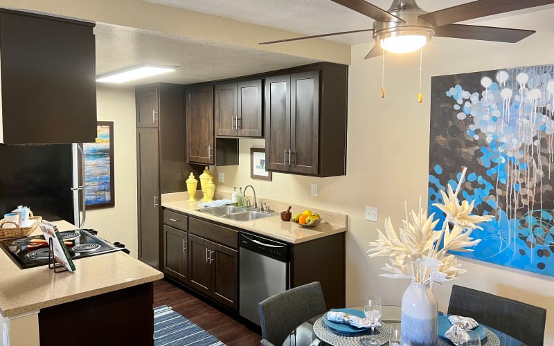 Espresso cabinets in the kitchen overlooking the dining room at Terra Nova Villas in Chula Vista, California