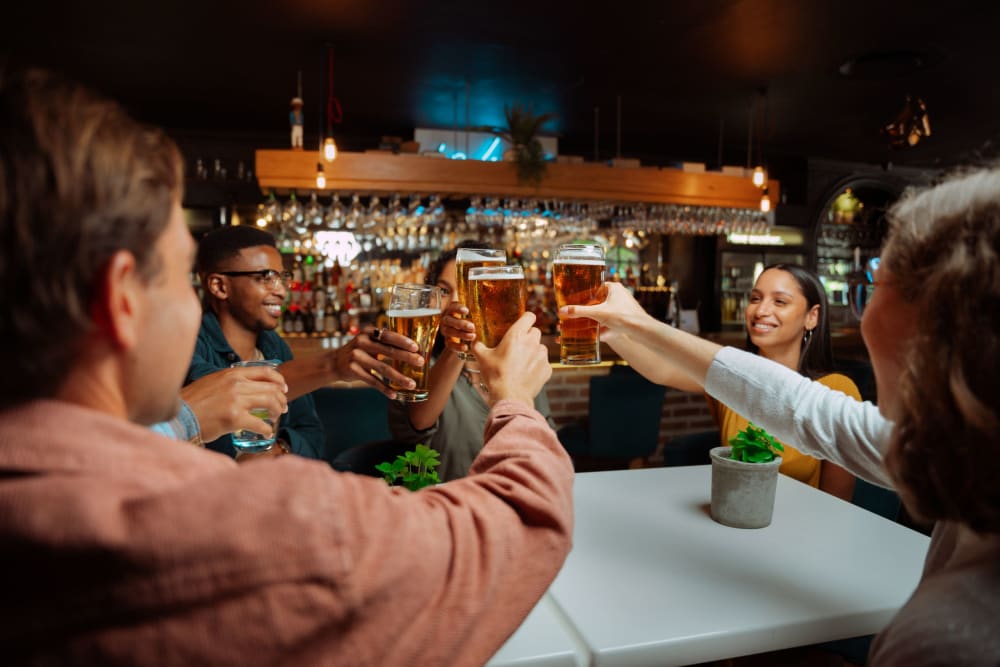 Friends enjoy a round of beers at their favorite spot near The Brookstone, Acworth, Georgia