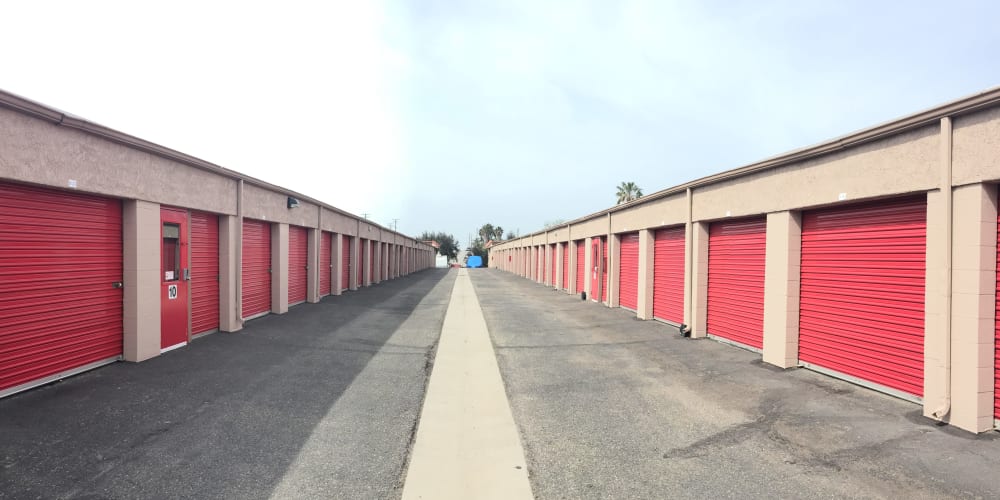 Drive-up access storage units with a wide driveway at StorQuest Express Self Service Storage in Mesa, Arizona