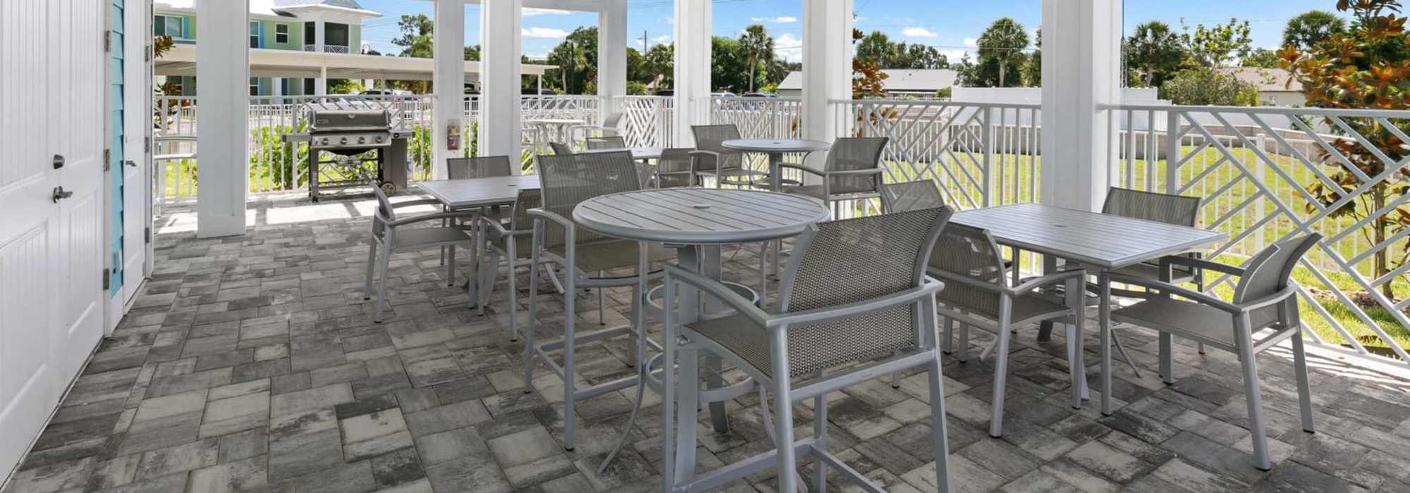 Charming outdoor dining area at Lemon Bay Apartments in Englewood, Florida.