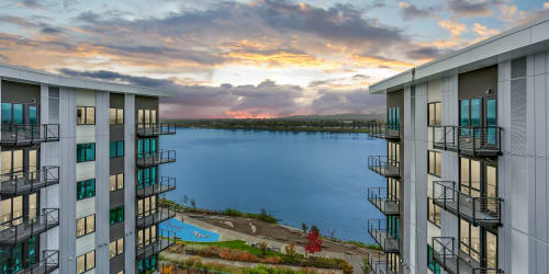 Sunset view of the building and the Columbia River at The Columbia at the Waterfront in Vancouver, Washington
