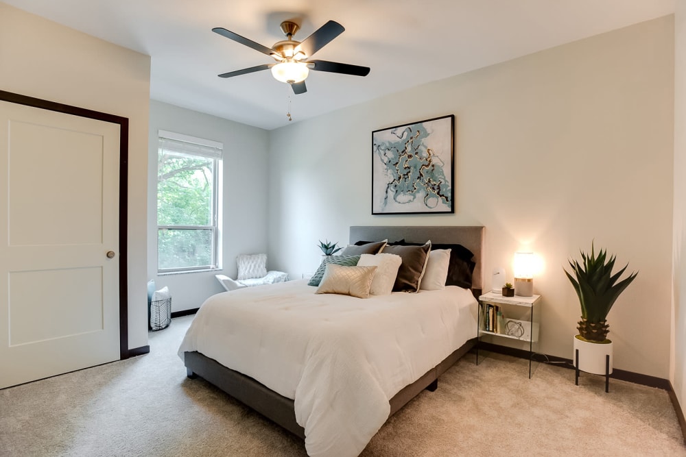 Spacious main bedroom with a large window for natural lighting at Lake Jonathan Flats in Chaska, Minnesota