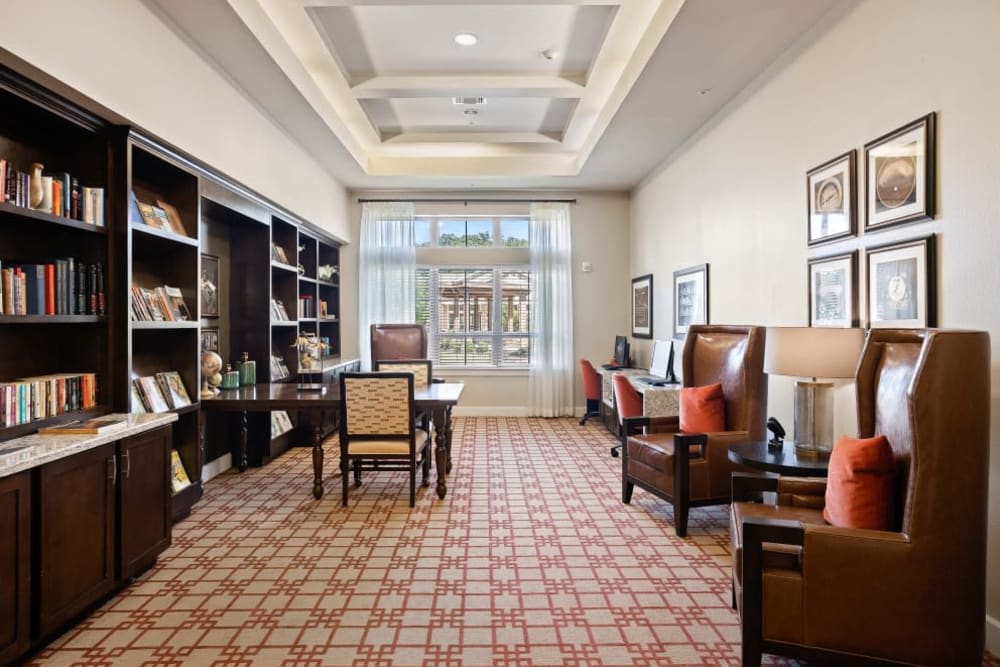 Elegant sitting area with bookcases at Anthology of Denton in Denton, Texas