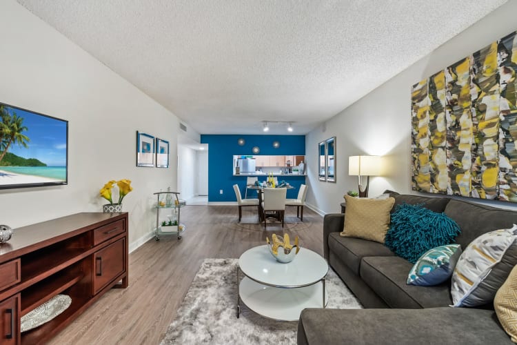 Open floor plan living and dining room area at Meadow Walk Apartments in Miami Lakes, Florida