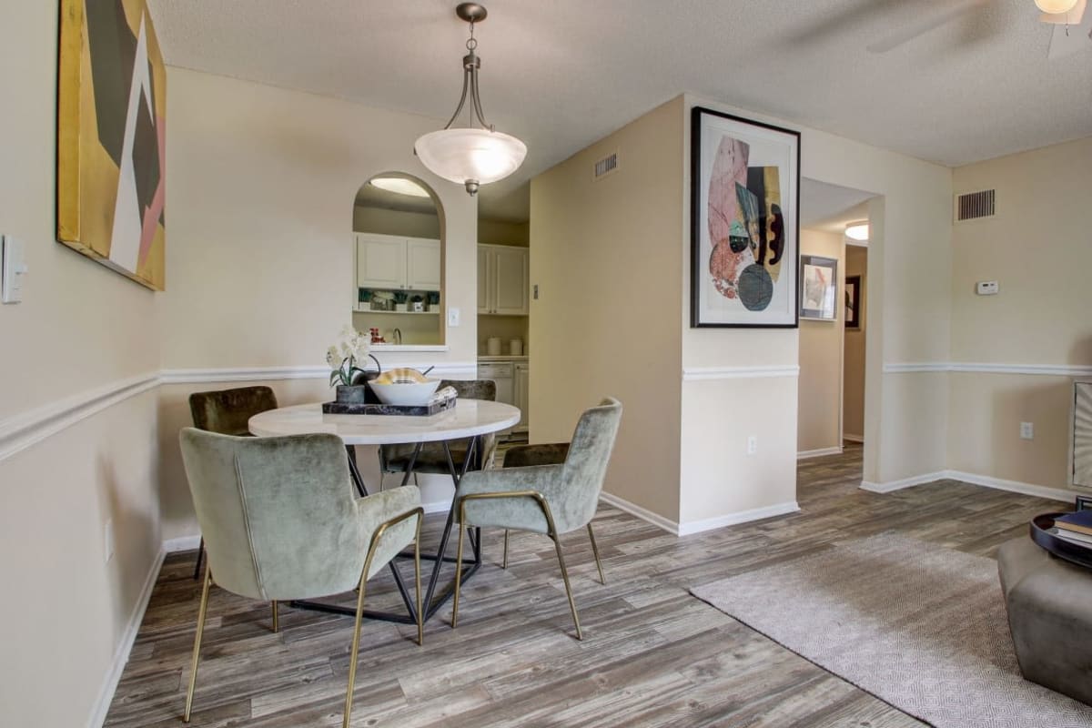 Wood-style flooring in an apartment dining area at Derby Park Apartments in Daytona Beach, Florida