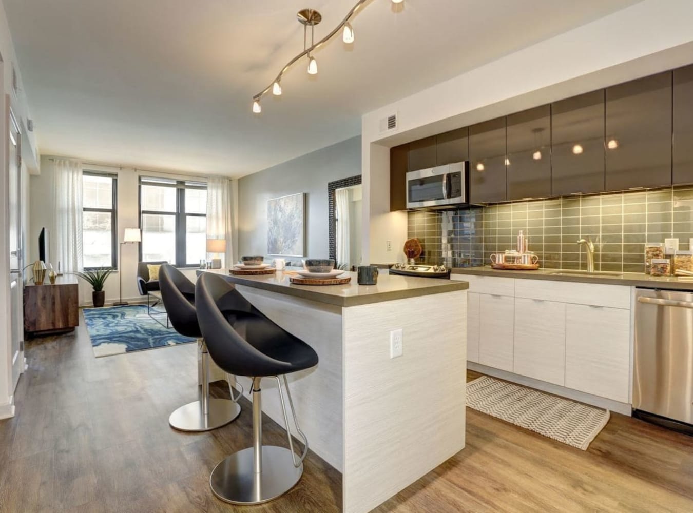 Dining area with kitchen at Solaire 7077 Woodmont in Bethesda, Maryland