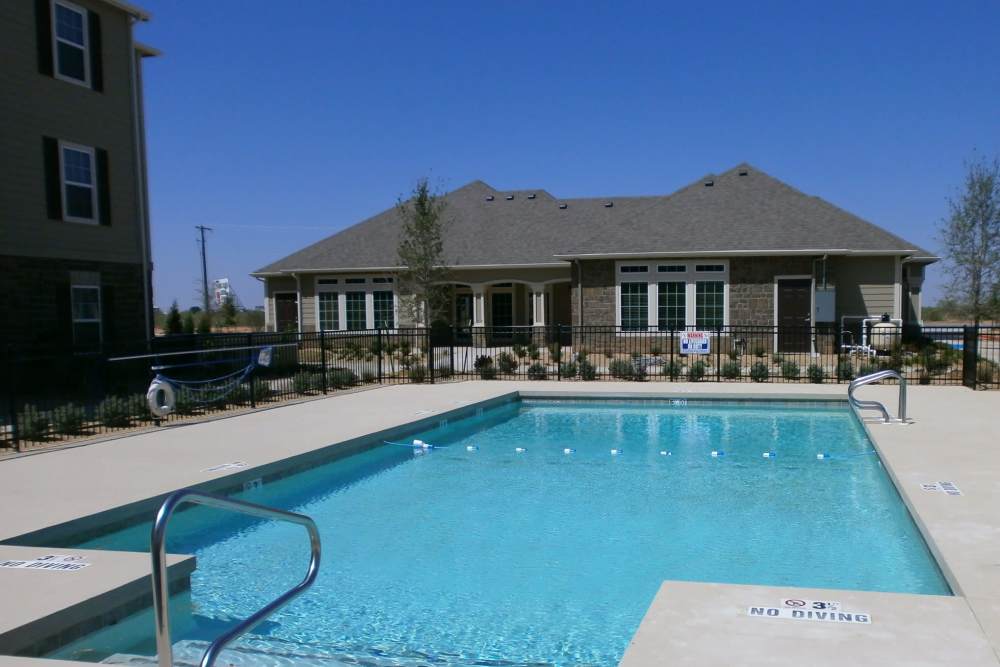 Resort-style pool at community clubhouse at Gateway Plaza Apartments in Midland, Texas