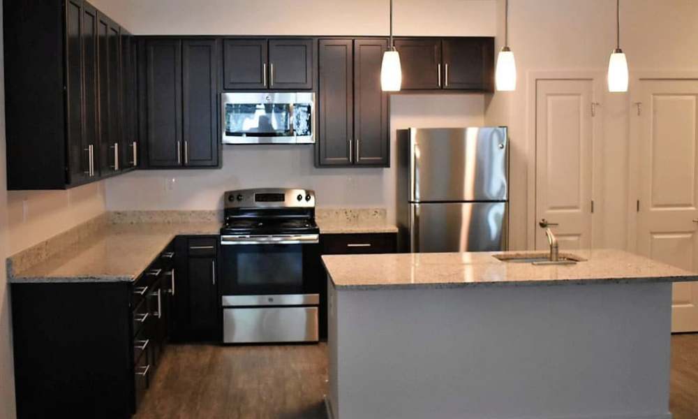 Modern kitchen with energy-efficient appliances at Burgess Mill Station in Ellicott City, Maryland