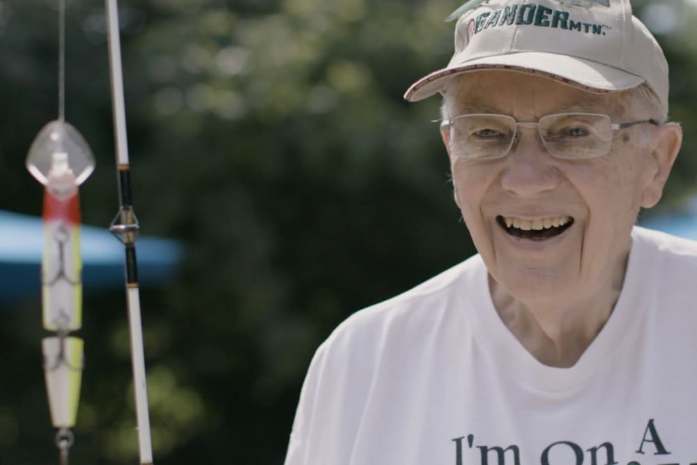 Resident fishing near a Anthology Senior Living location