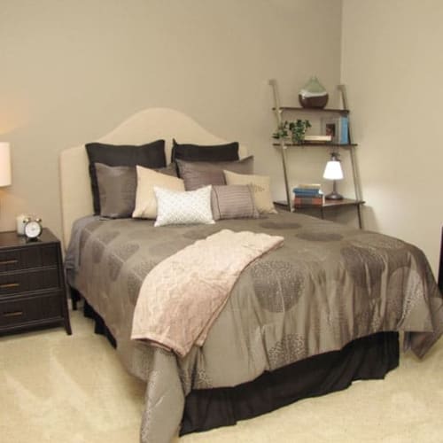 Bedroom with furniture at Pinnacle at Galleria Apartments in Roseville, California