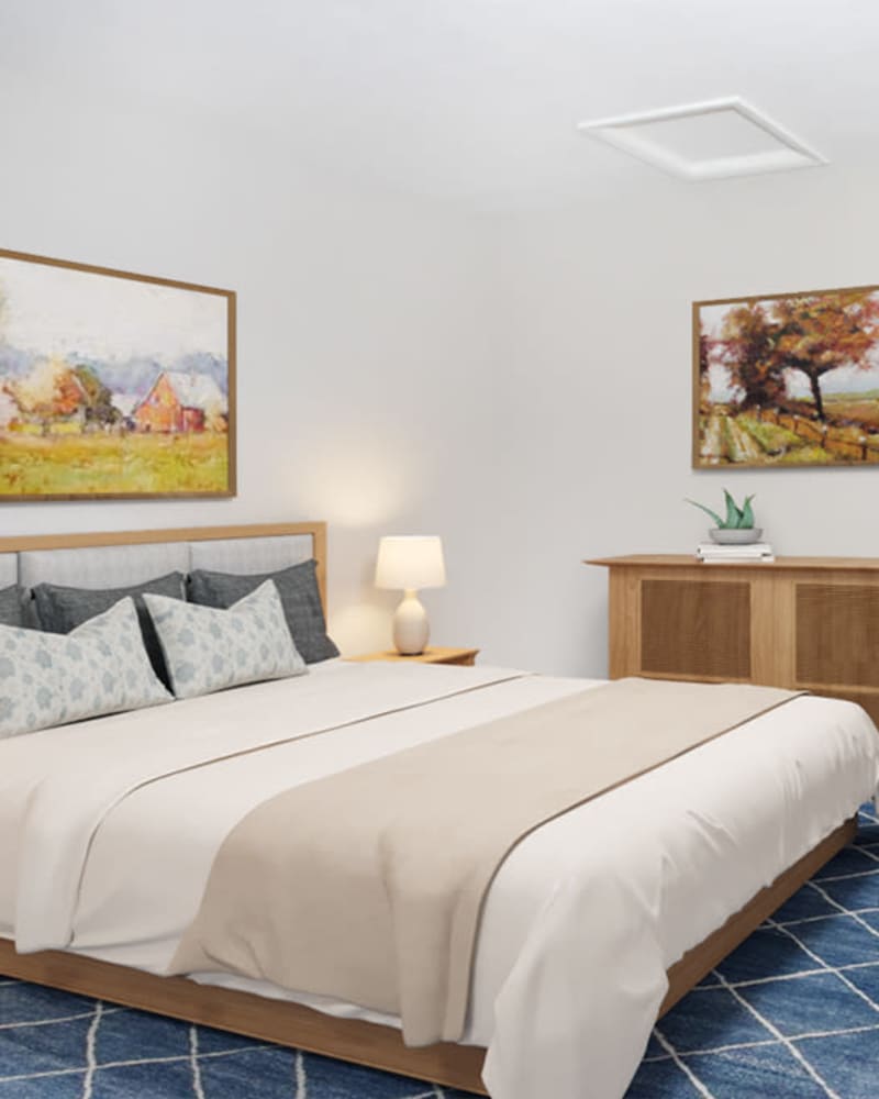 A large bed in a model apartment bedroom at Residence at Marathon in Columbus, Georgia