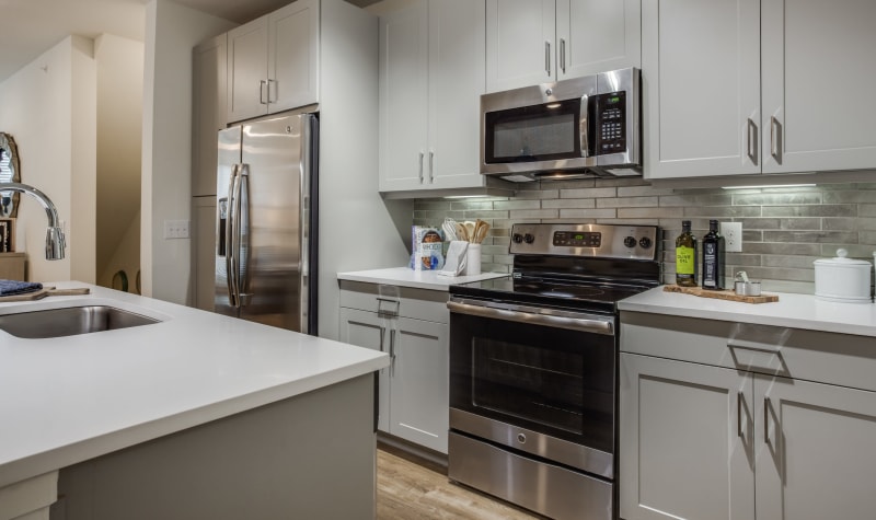 Sleek, modern kitchen at Atwood at Ellison in Dallas, Texas