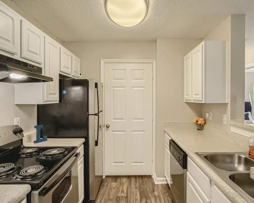 Apartment kitchen with white cabinetry and stainless-steel appliances at Leaf Stone Apartments in Covington,Georgia