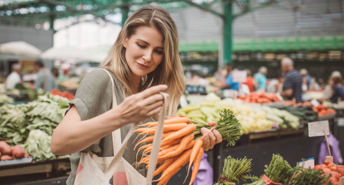 Resident shopping for produce in Palmyra, New Jersey near River Villas