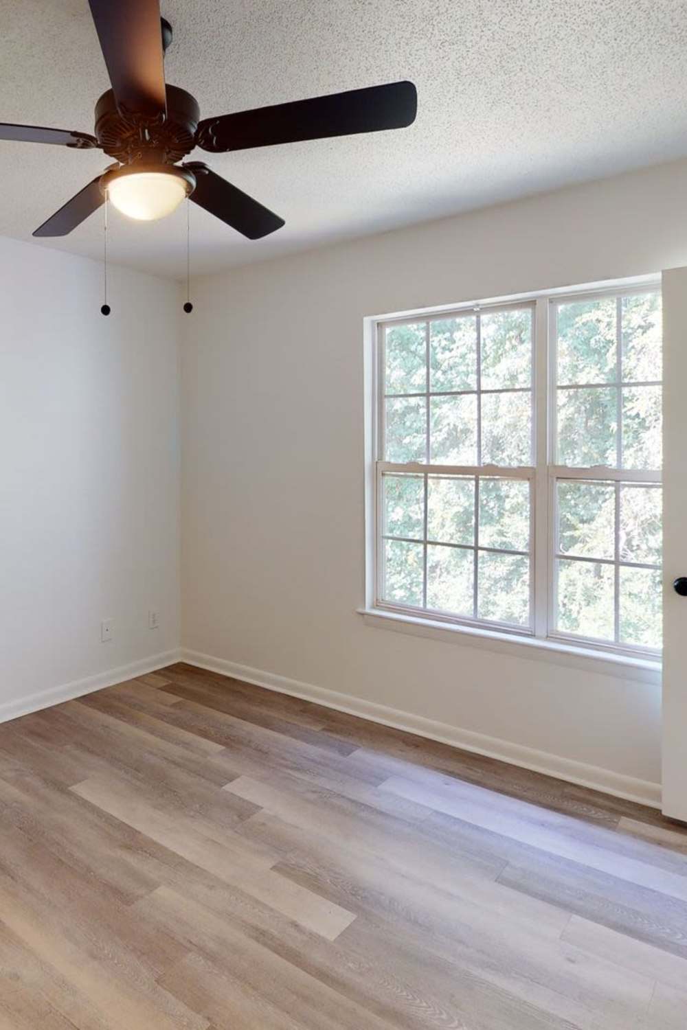 Bedroom with window at Wallace Terrace Apartments in Charlotte, North Carolina 