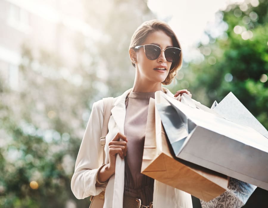 A resident with shopping bags at The District at Scottsdale in Scottsdale, Arizona