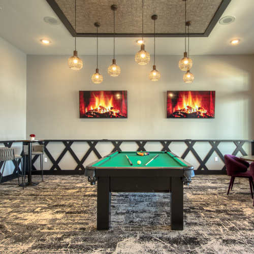 Game room with pool table and pendant lights at The Mason in Augusta, Georgia
