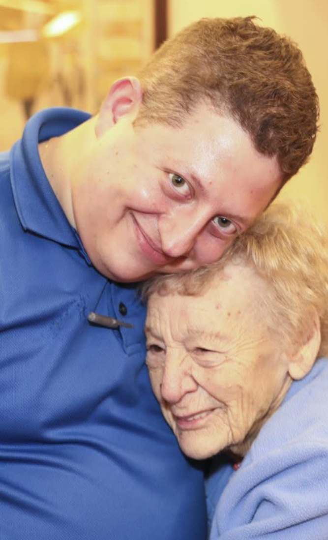 staff hugging a resident at Dougherty Ferry in Valley Park, Missouri