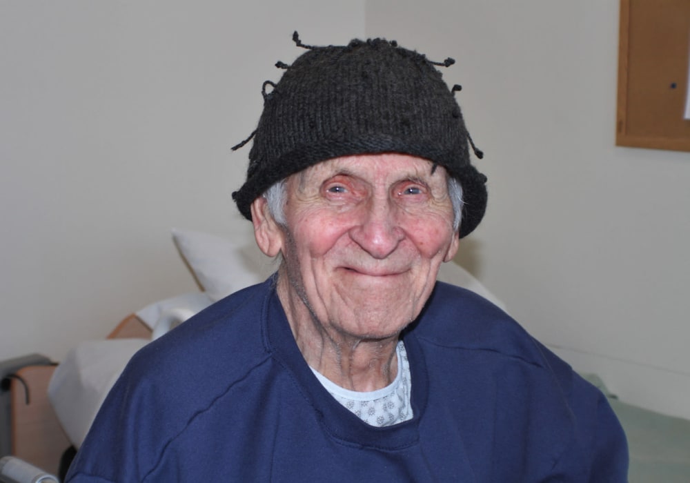 Happy resident comfortable in his room at Edgerton Care Center in Edgerton, Wisconsin