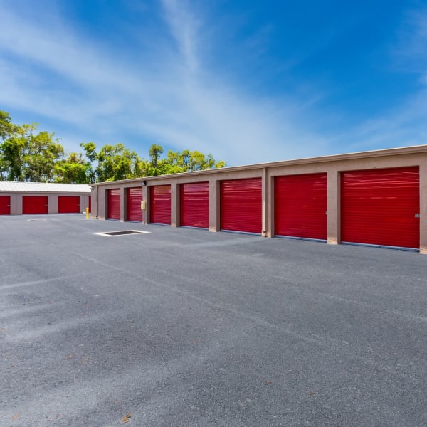 Large outdoor storage units with wide drive aisles at StorQuest Self Storage in Bradenton, Florida