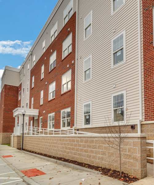 Building exterior with ramp for easy access at Hobbs Greene in Wheeling, West Virginia