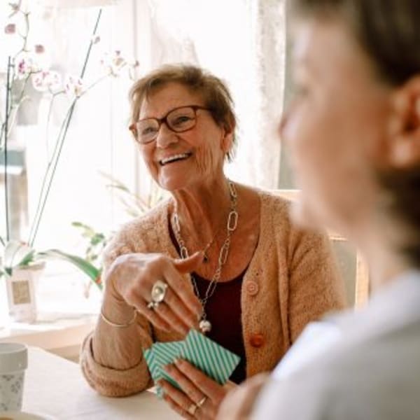 Residents enjoy a card game at Acclaim at Belmont Bay, Woodbridge, Virginia