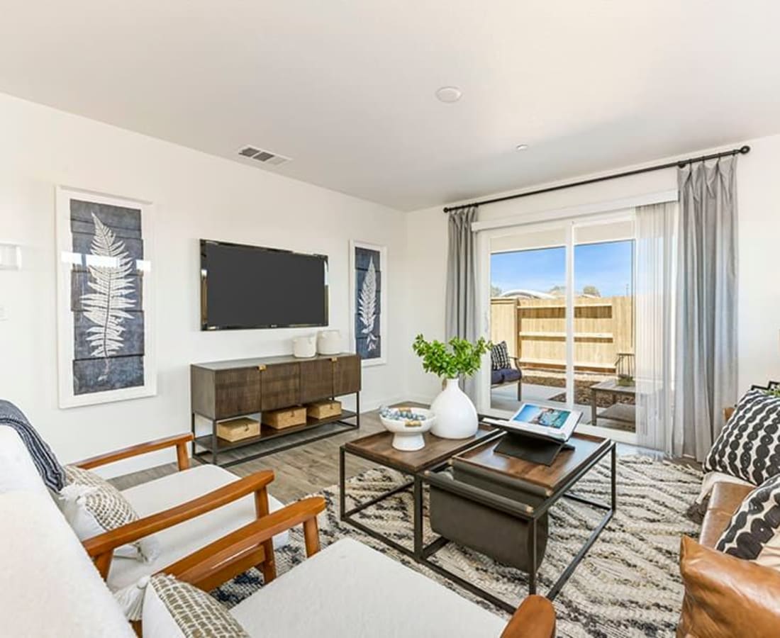 Living room with door to patio at Isles in Roseville, California