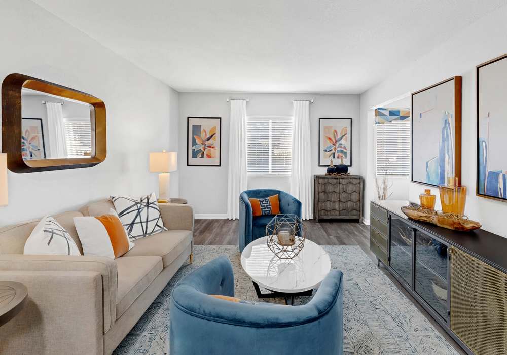 Renovated Living Room with ample lighting at Hidden Creek Village in Fayetteville, North Carolina