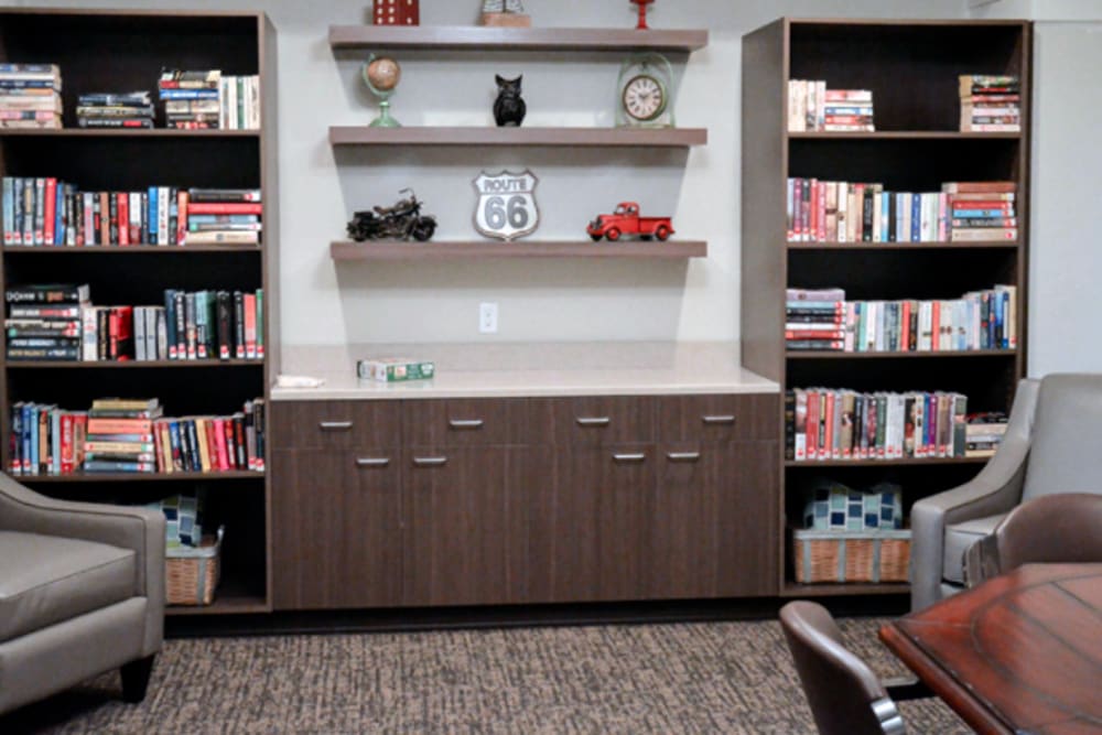 Reading corner with 2 stocked bookshelves at Aspen Valley Senior Living in Boise, Idaho