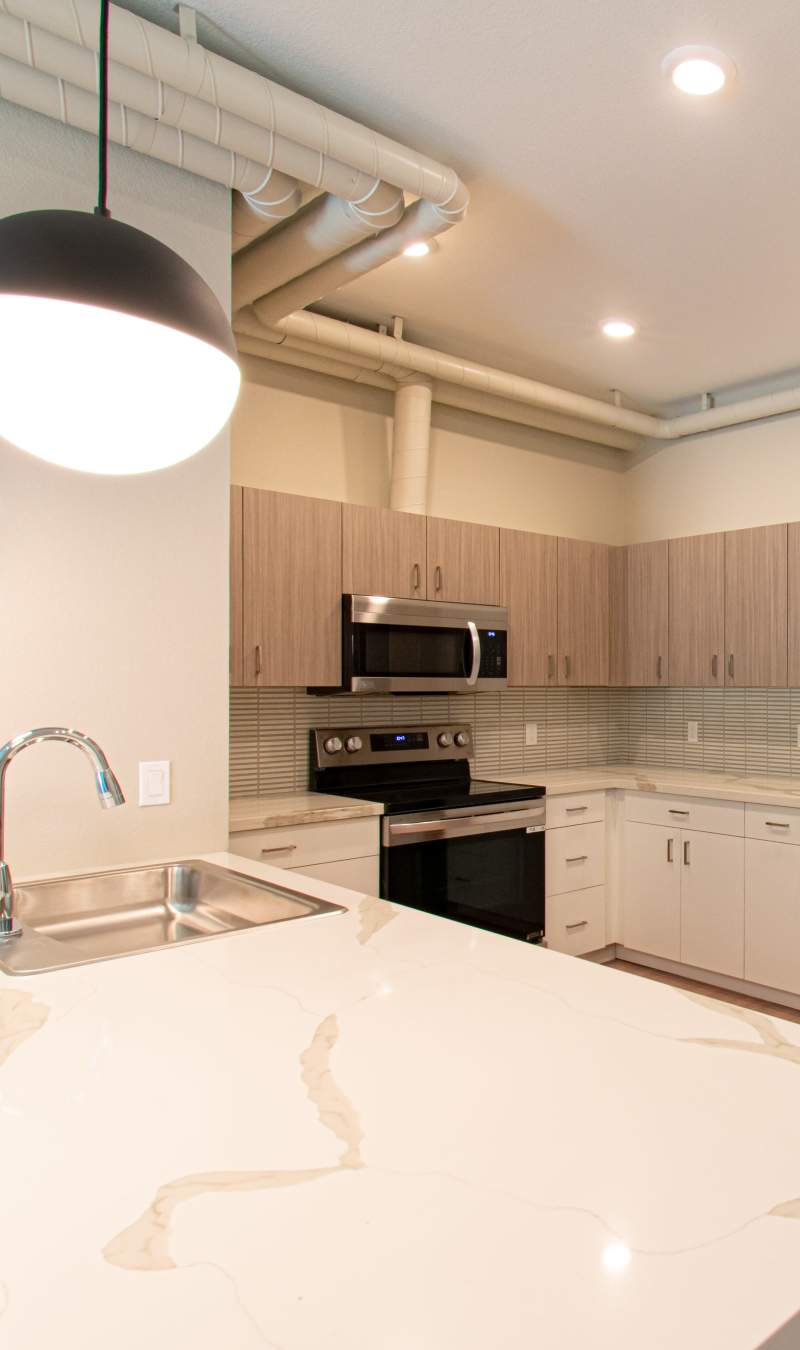 Bathroom with lighted vanity at Stone Village Apartments in Reno, Nevada