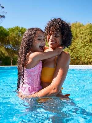 Resident and her daughter playing in the pool at The Jade at Avondale in Decatur, Georgia