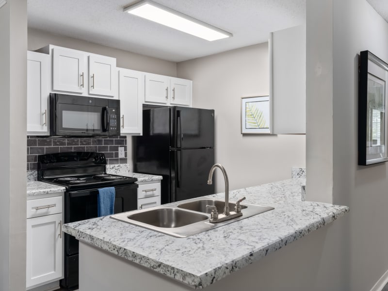 Spacious kitchen in a model apartment at Lenox Gates in Mobile, Alabama