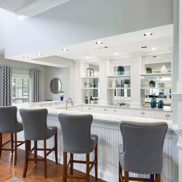 Bar seating in the resident clubhouse lounge at The Vinings at Newnan Lakes in Newnan, Georgia