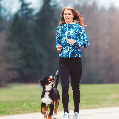 a resident running with her dog at Gela Point in Virginia Beach, Virginia