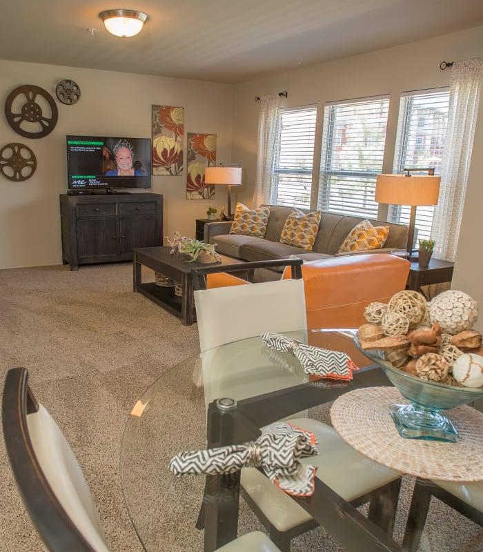 Spacious living room with view of dining room at The Reserve at Elm in Jenks, Oklahoma