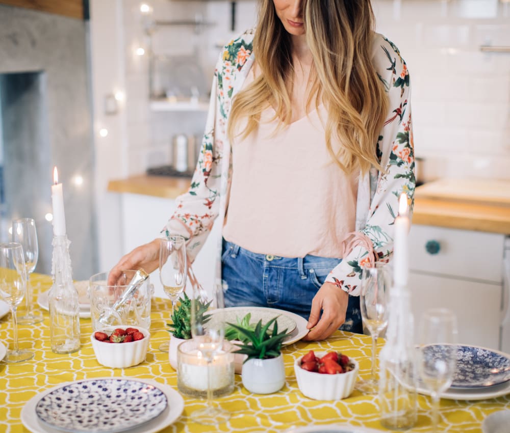 Resident preparing a meal in her new kitchen at The Villas at Woodland Hills in Woodland Hills, California