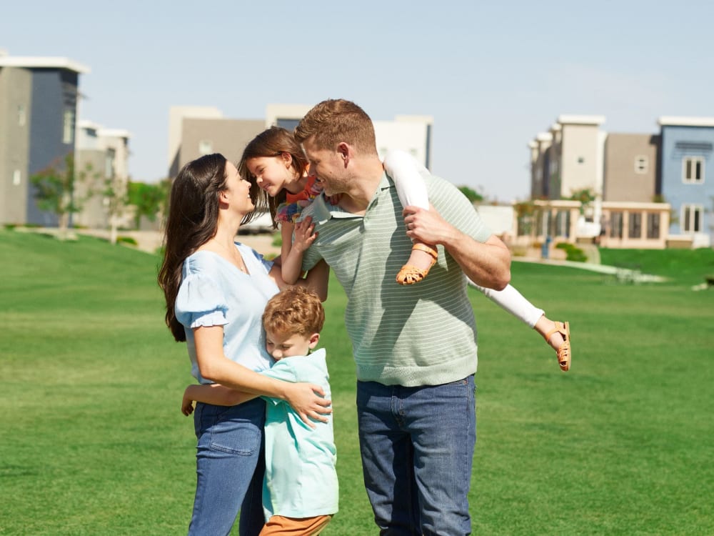 Residents playing on the grass area at BB Living Union Park in Phoenix, Arizona