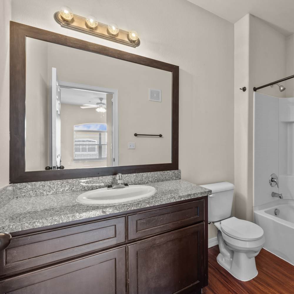 Bathroom with storage vanity at Las Torres Apartments in El Paso, Texas