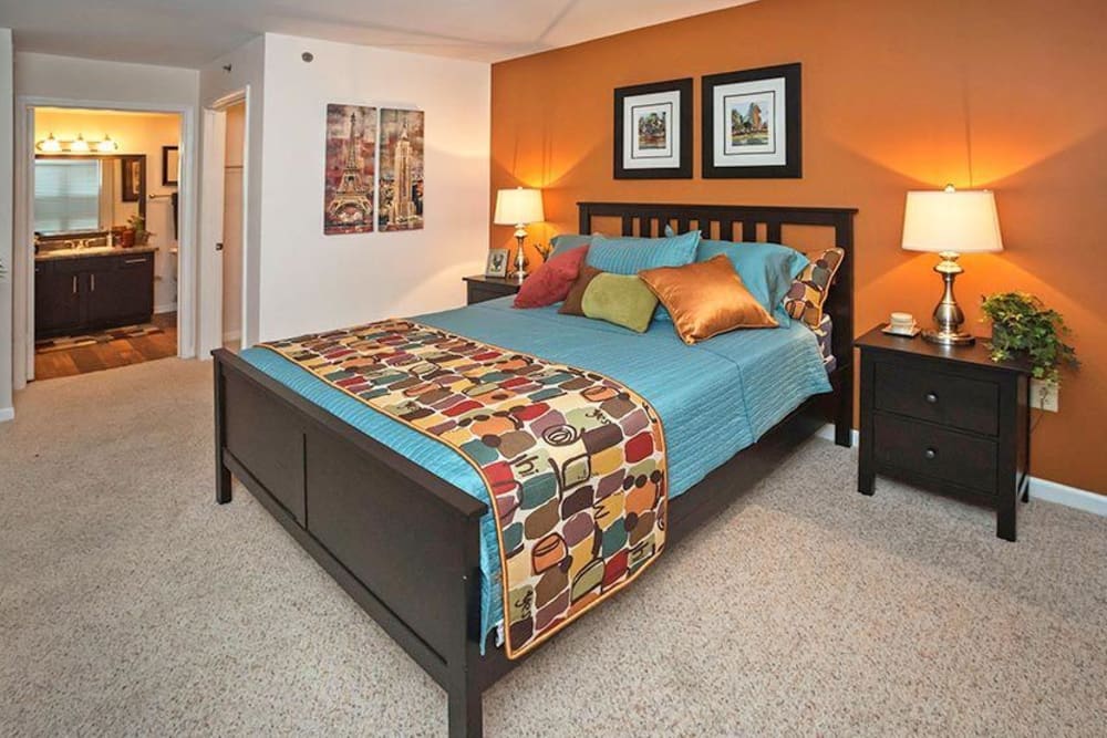 Model home's primary bedroom with an accent wall at City Plaza in Atlanta, Georgia